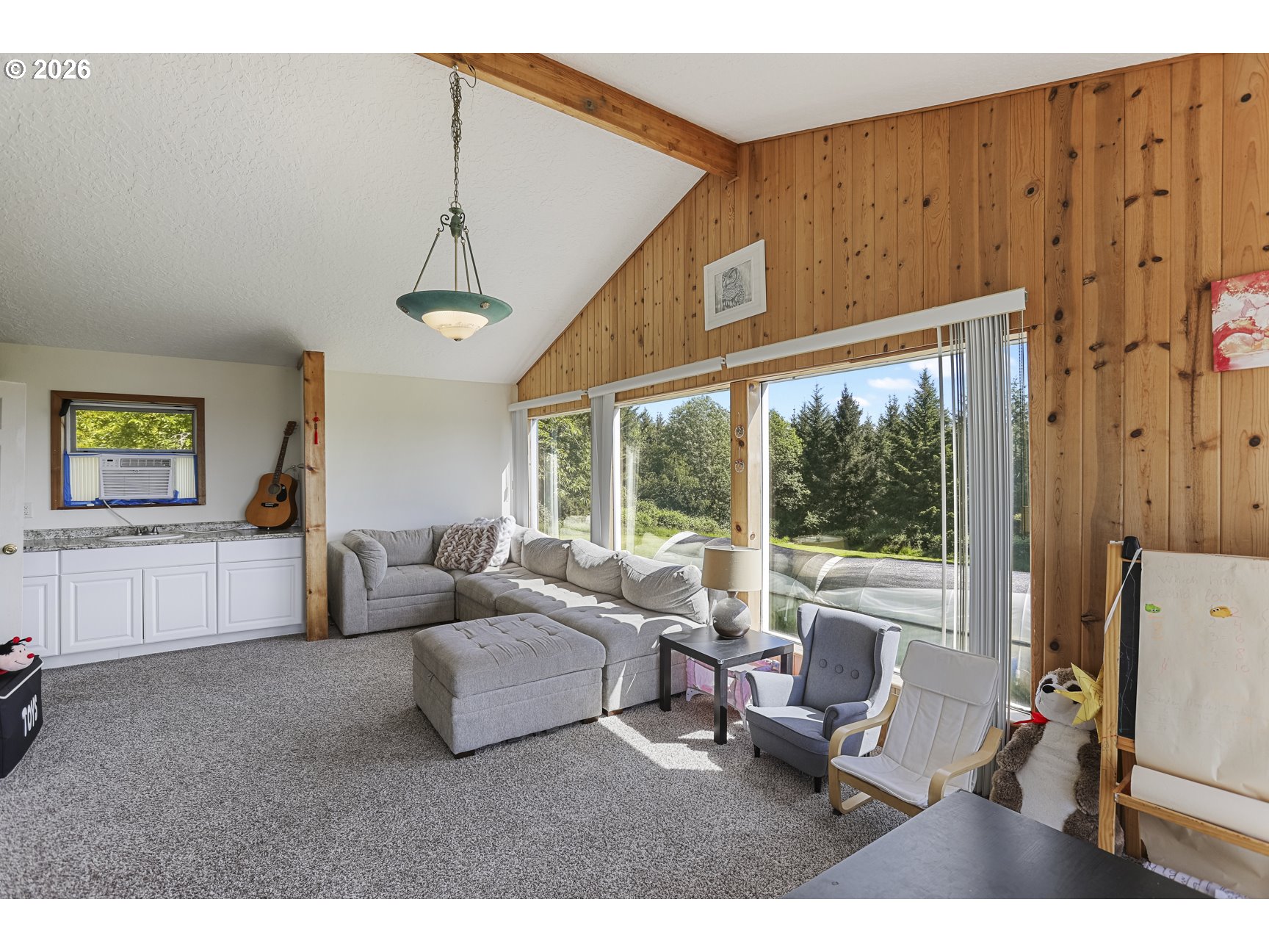 33411 Blaha Road Warren, OR 97053 - Photo 28 of 48 a living room with furniture and a large window