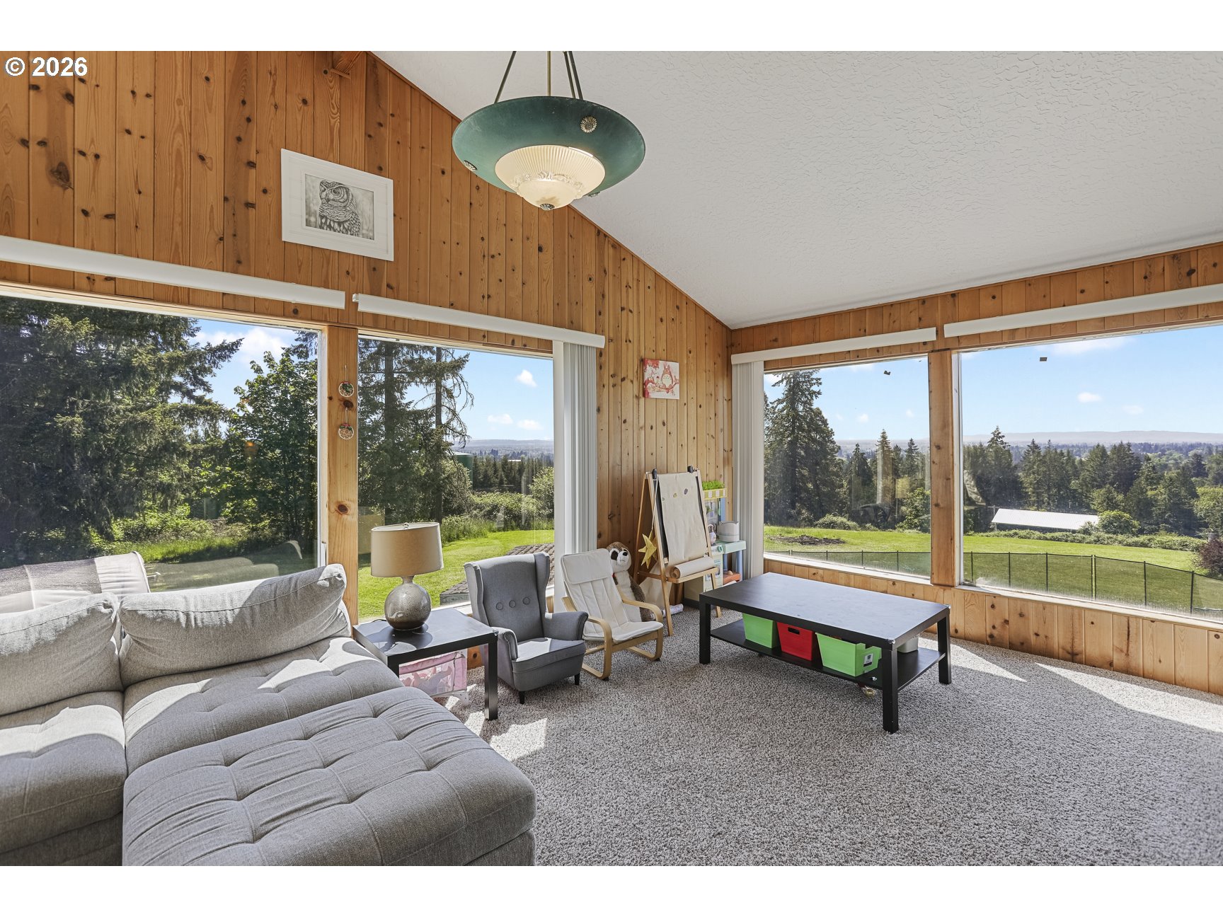 33411 Blaha Road Warren, OR 97053 - Photo 29 of 48 a living room with furniture and a large window