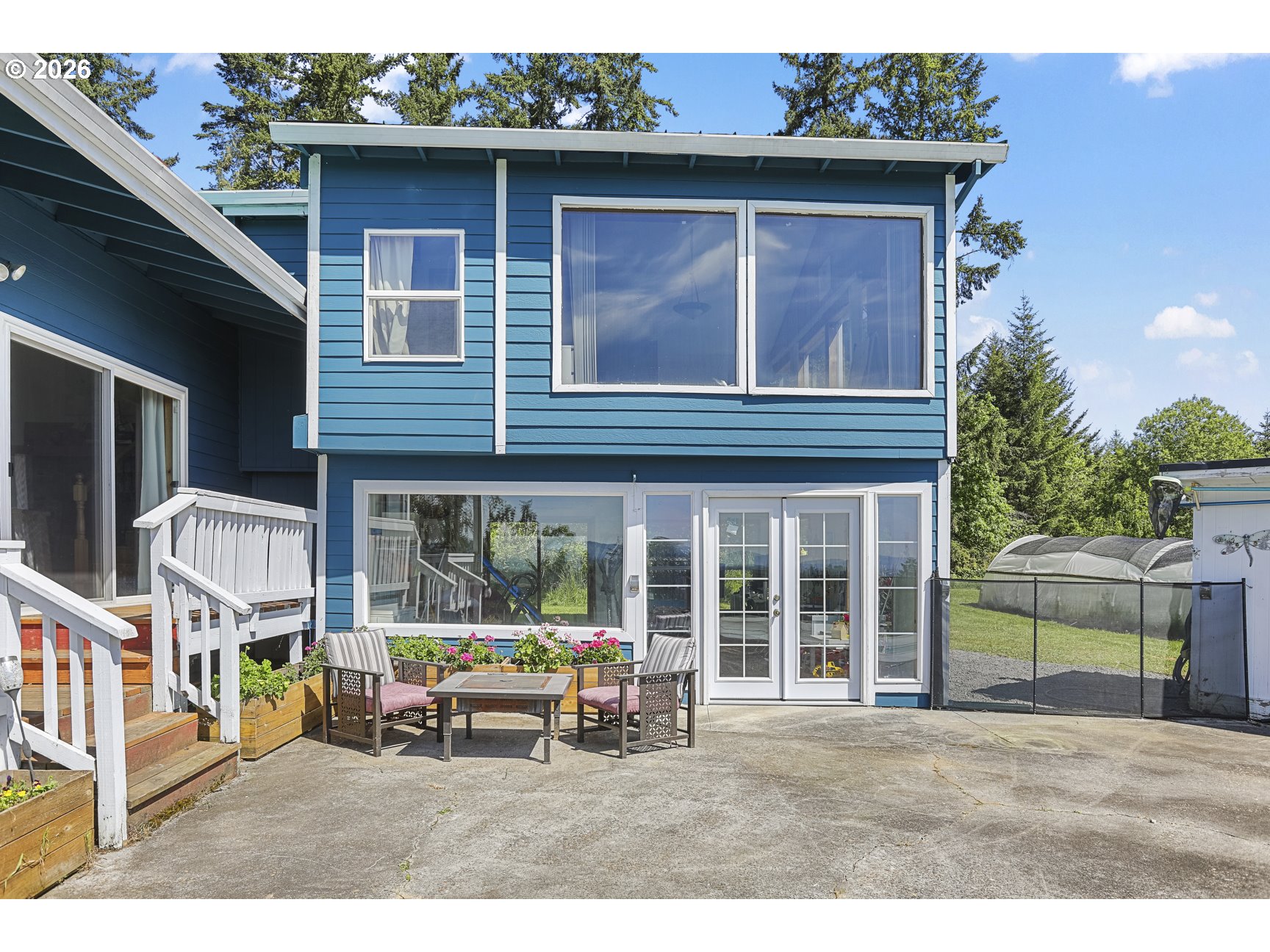 33411 Blaha Road Warren, OR 97053 - Photo 39 of 48 a backyard of a house with table and chairs