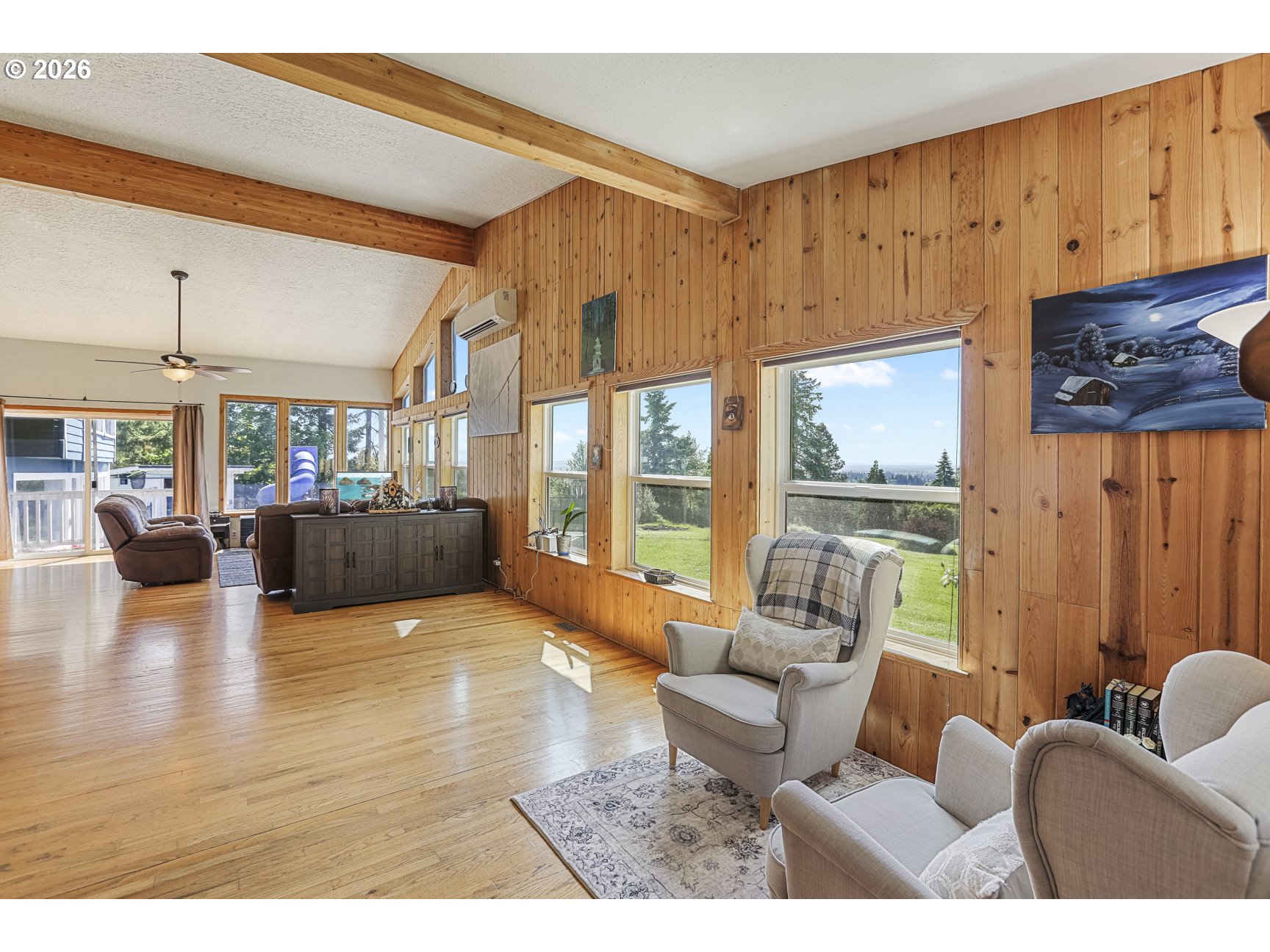 33411 Blaha Road Warren, OR 97053 - Photo 4 of 48 a living room with furniture wooden floor and a large window