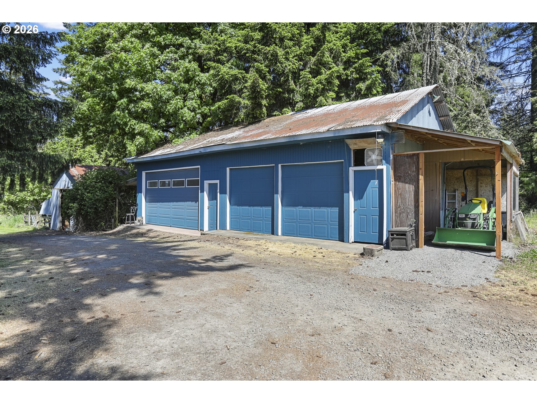 33411 Blaha Road Warren, OR 97053 - Photo 44 of 48 a view of a house with a yard and garage