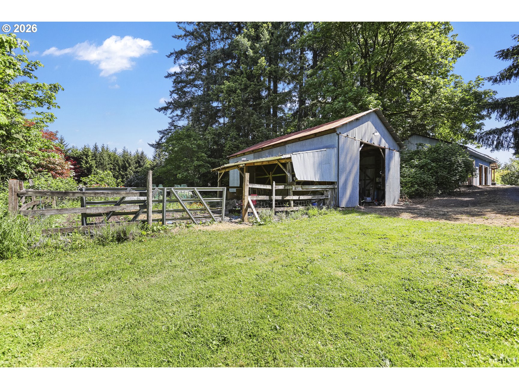 33411 Blaha Road Warren, OR 97053 - Photo 46 of 48 a backyard of a house with table and chairs