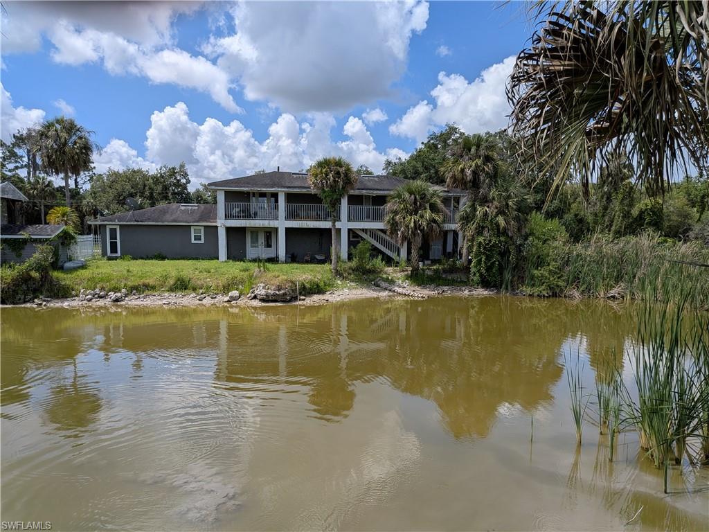 17191 Frank Road Alva, FL 33920 - Photo 2 of 27 a view of a lake with house