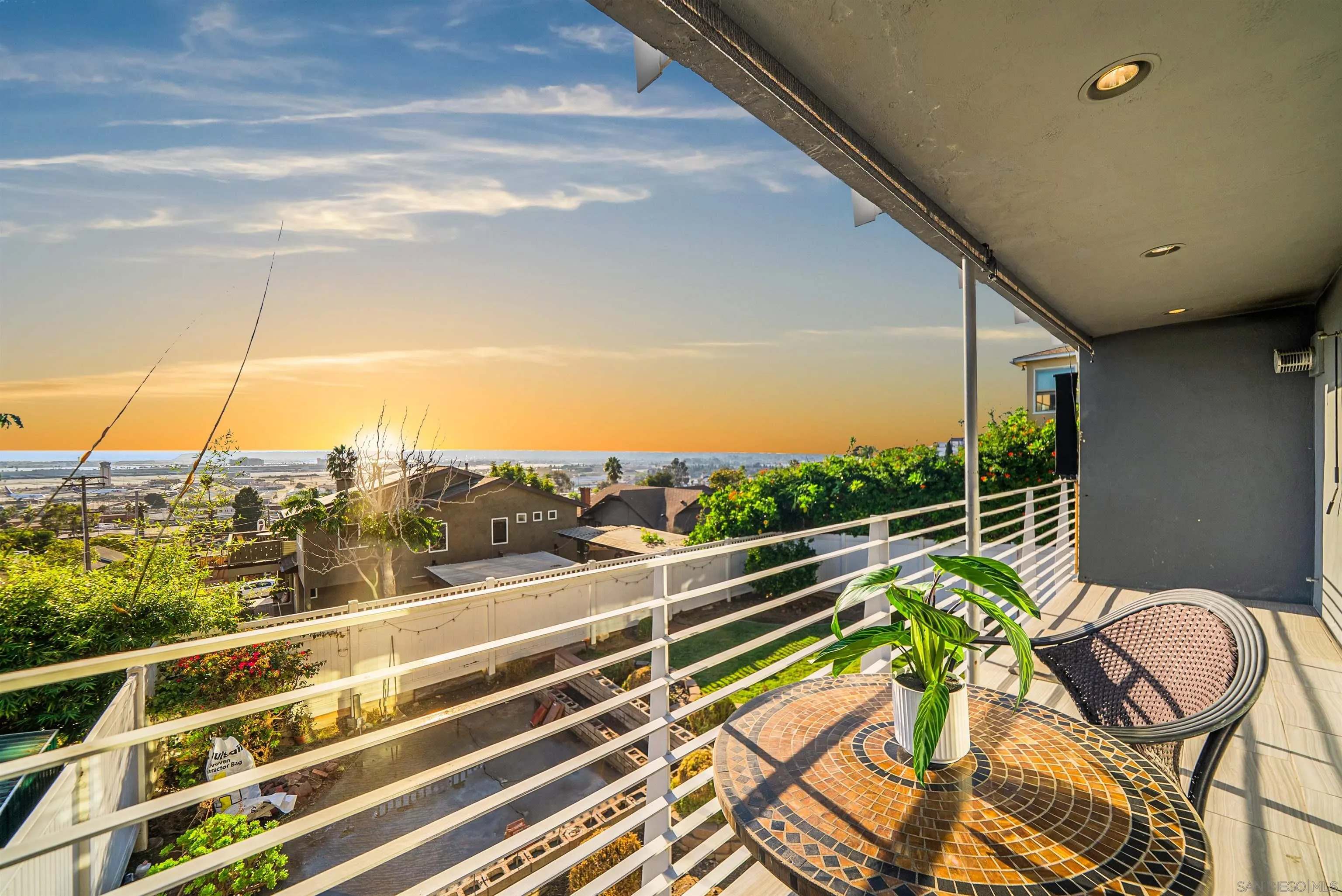 a view of a balcony with chairs