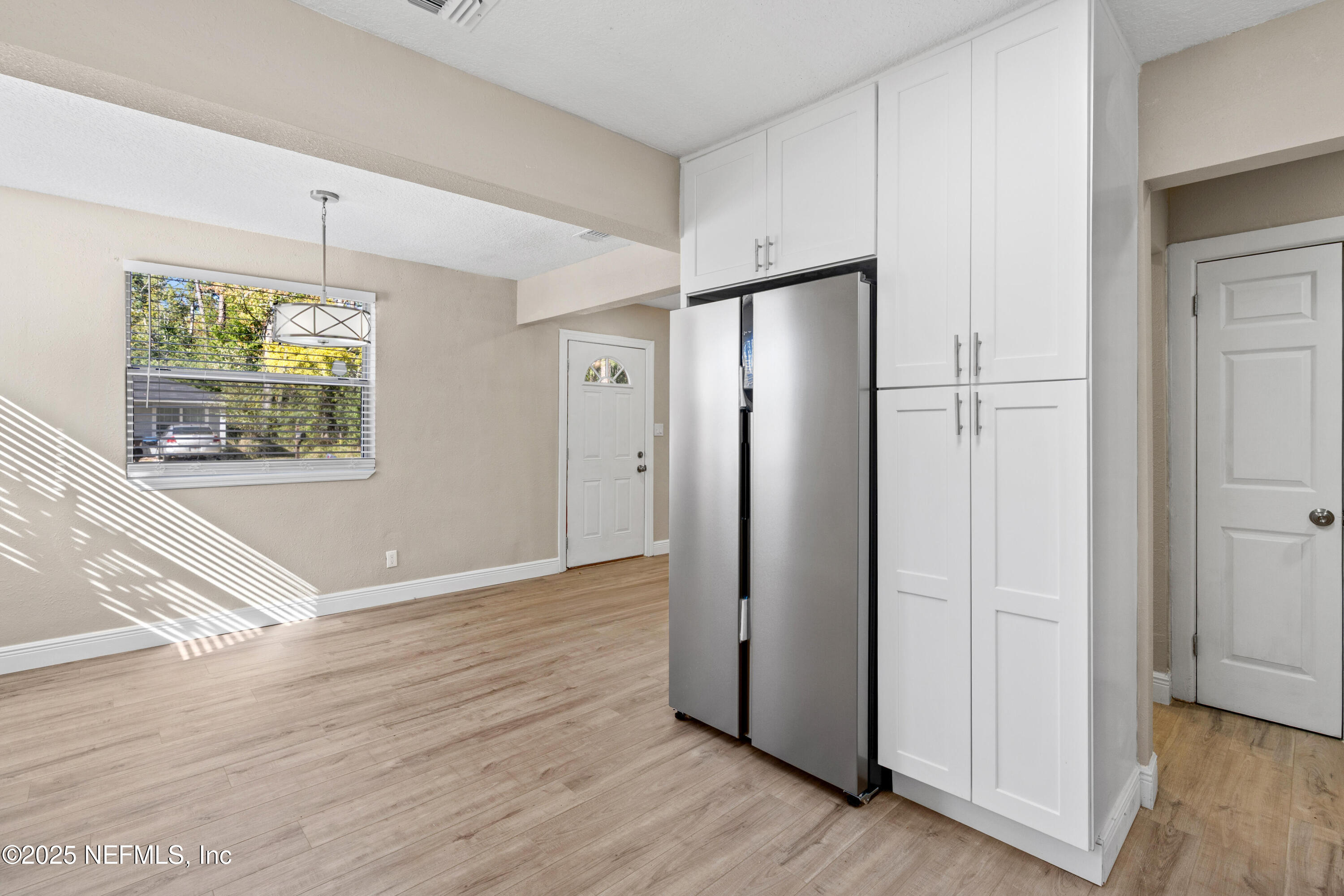 1169 Comanche Street Jacksonville, FL 32205 - Photo 14 of 24 an empty room with wooden floor and window