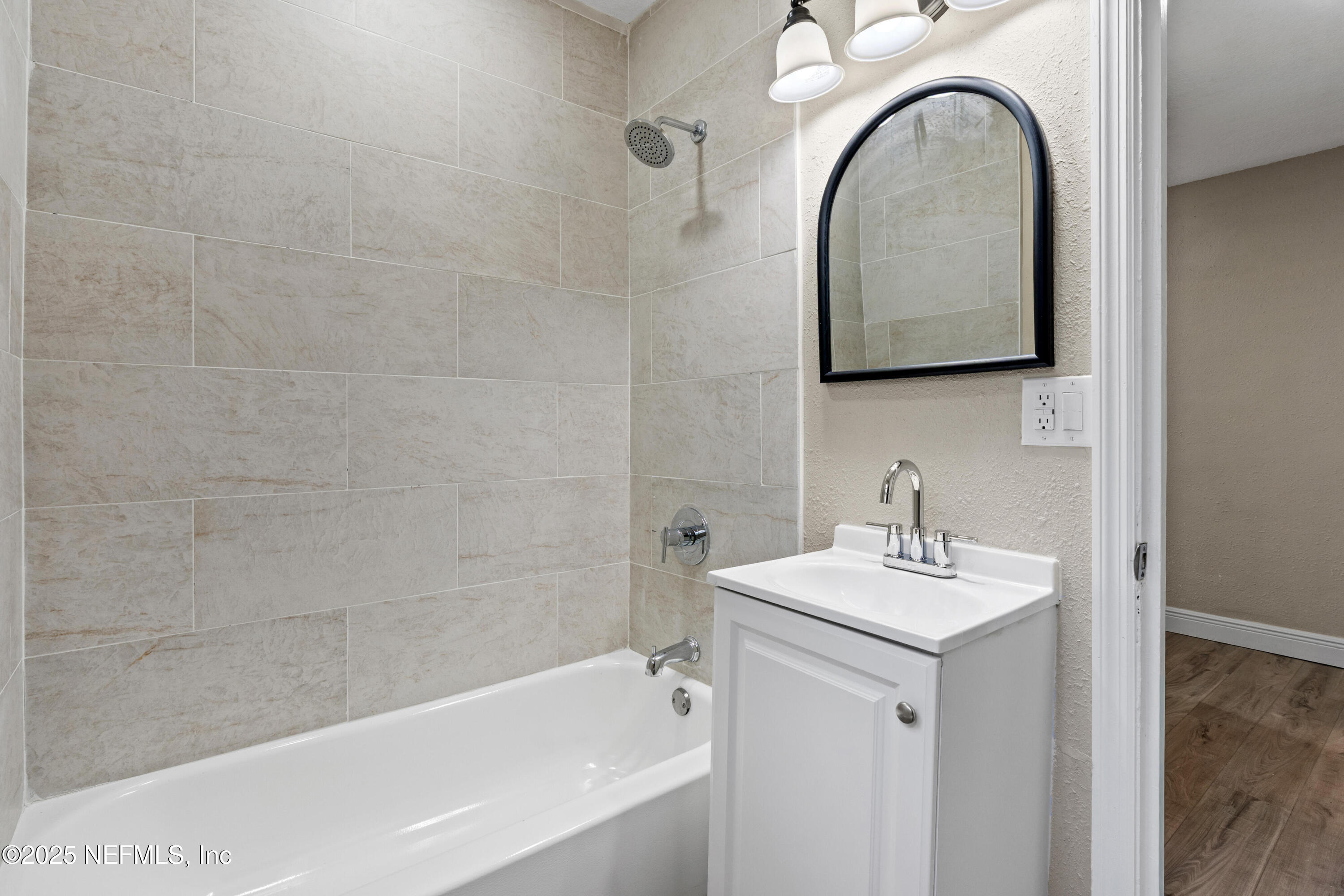 1169 Comanche Street Jacksonville, FL 32205 - Photo 16 of 24 a bathroom with a sink and a mirror