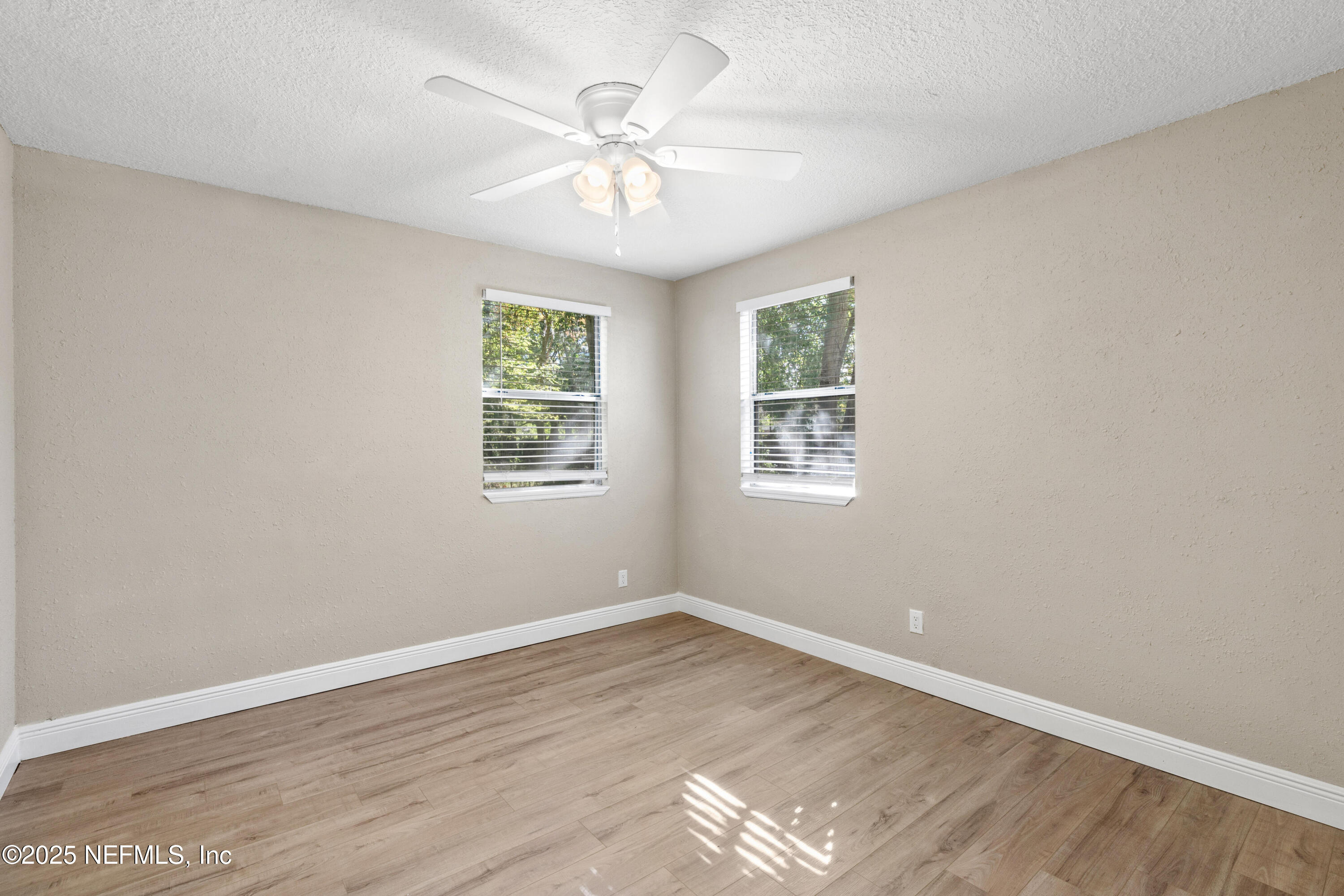 1169 Comanche Street Jacksonville, FL 32205 - Photo 20 of 24 wooden floor in an empty room with a window