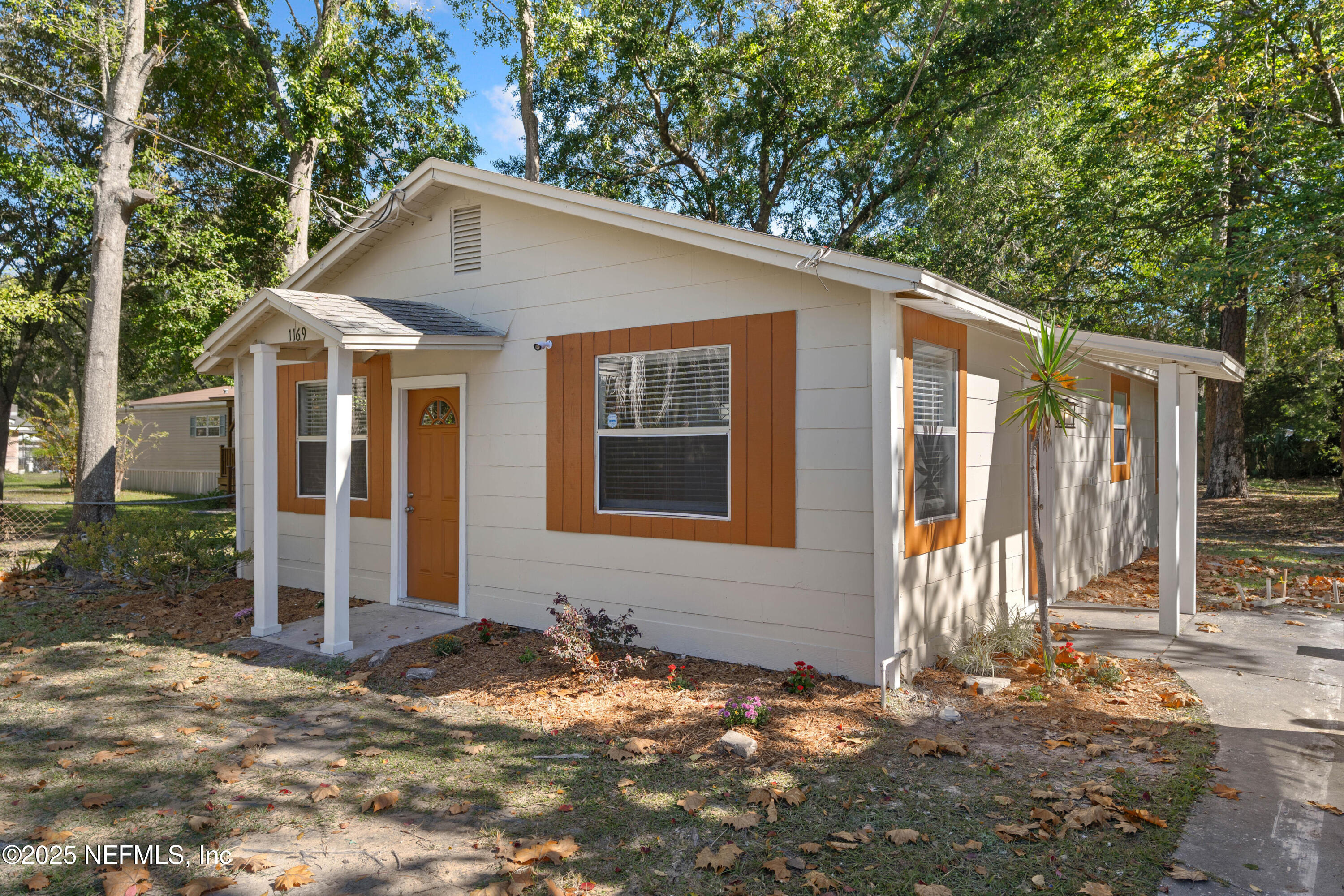 1169 Comanche Street Jacksonville, FL 32205 - Photo 3 of 24 a front view of a house with a yard
