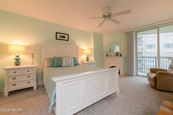 a large white bed in a white room