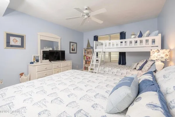 a bathroom with a granite countertop sink a toilet and a shower