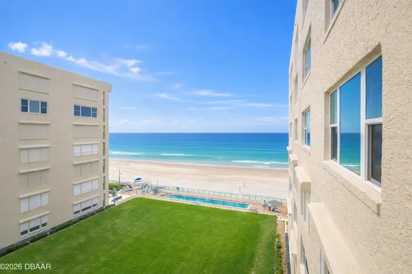 a view of a balcony with furniture