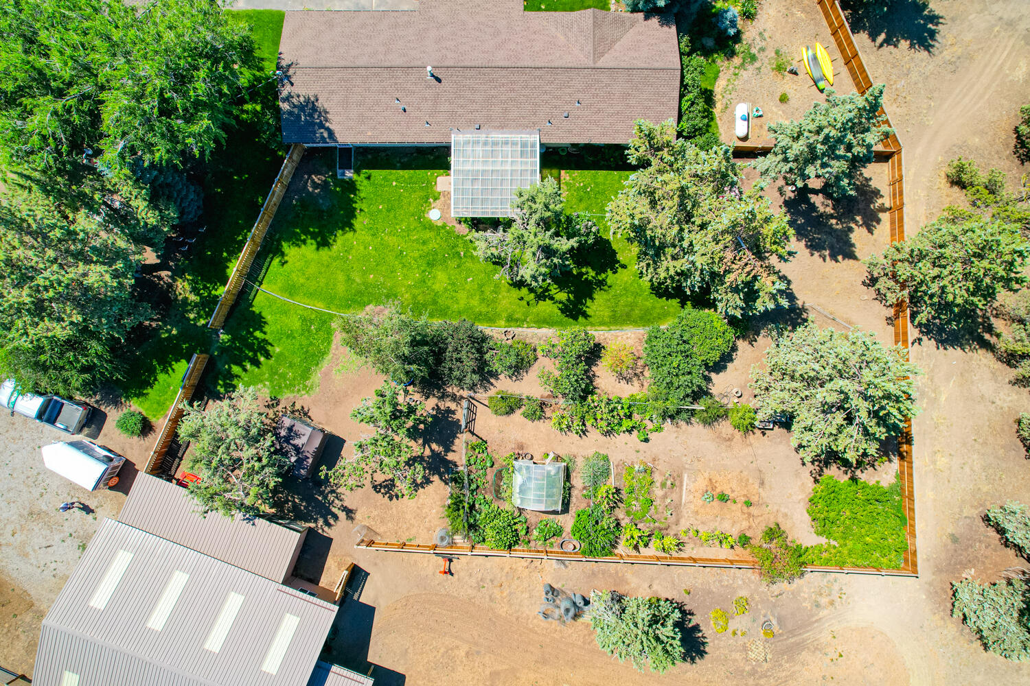 2218 Southwest 79th Street Redmond, OR 97756 - Photo 39 of 54 an aerial view of a house with a yard and large trees