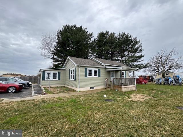 2185 East Wheat Road, Unit D Vineland, NJ 08361 - Photo 2 of 25 a front view of a house with a yard and garage