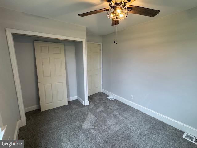 2185 East Wheat Road, Unit D Vineland, NJ 08361 - Photo 21 of 25 an empty room with a chandelier fan and closet
