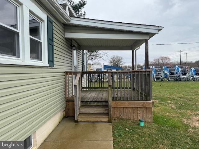 2185 East Wheat Road, Unit D Vineland, NJ 08361 - Photo 3 of 25 a view of a deck with a big yard