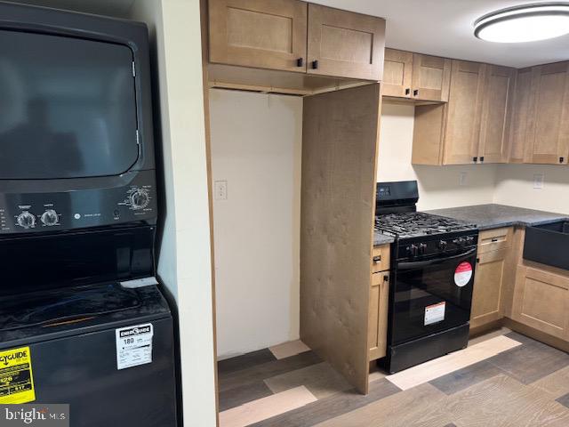 2185 East Wheat Road, Unit D Vineland, NJ 08361 - Photo 7 of 25 a kitchen with stainless steel appliances granite countertop a refrigerator and a stove