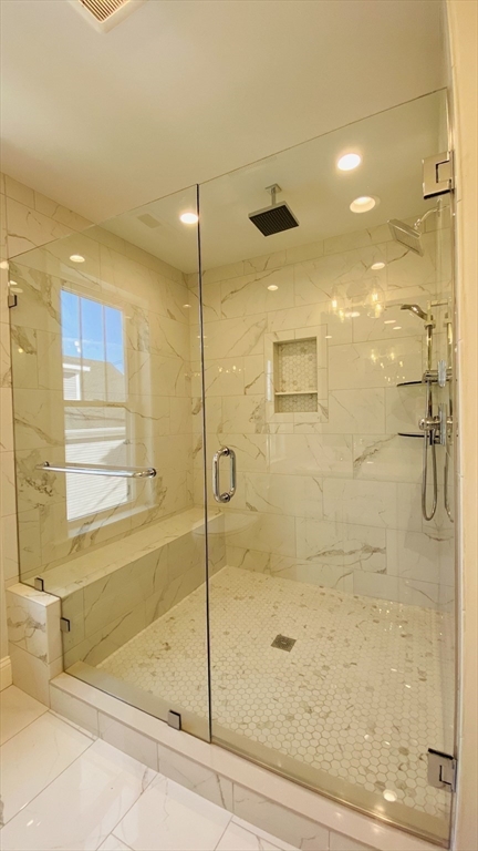 211 West Street, Unit 211 Needham, MA 02494 - Photo 5 of 12 a bathroom with a glass shower door and a shower