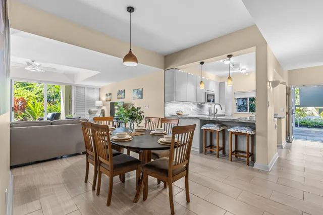 a dining room with furniture and window