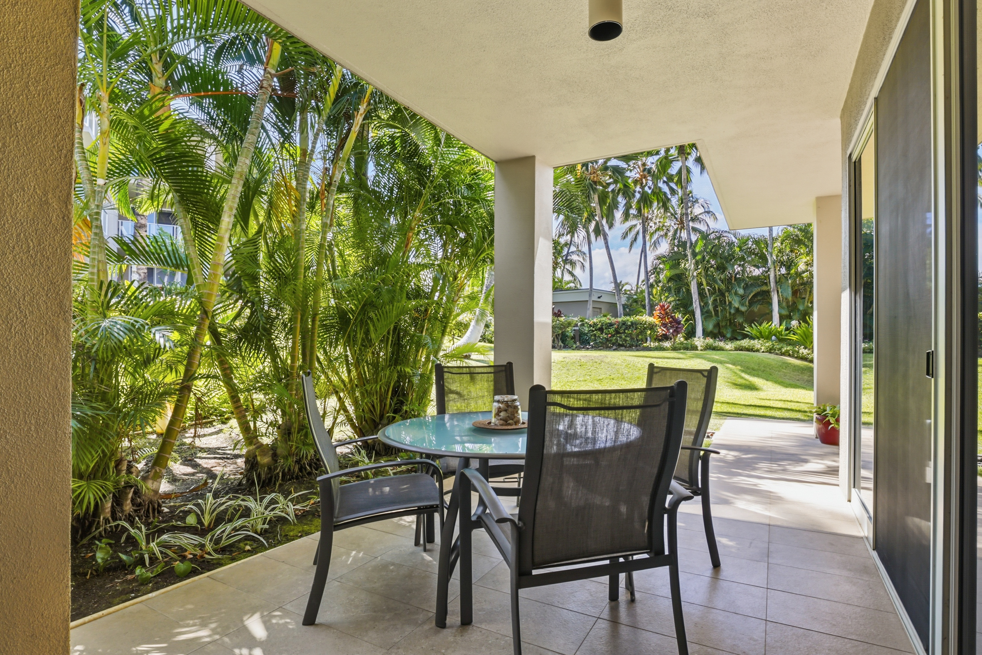 69-1010 Keana Place, Unit B101 Waikoloa, HI 96738 - Photo 11 of 30 a view of a porch with chairs and backyard
