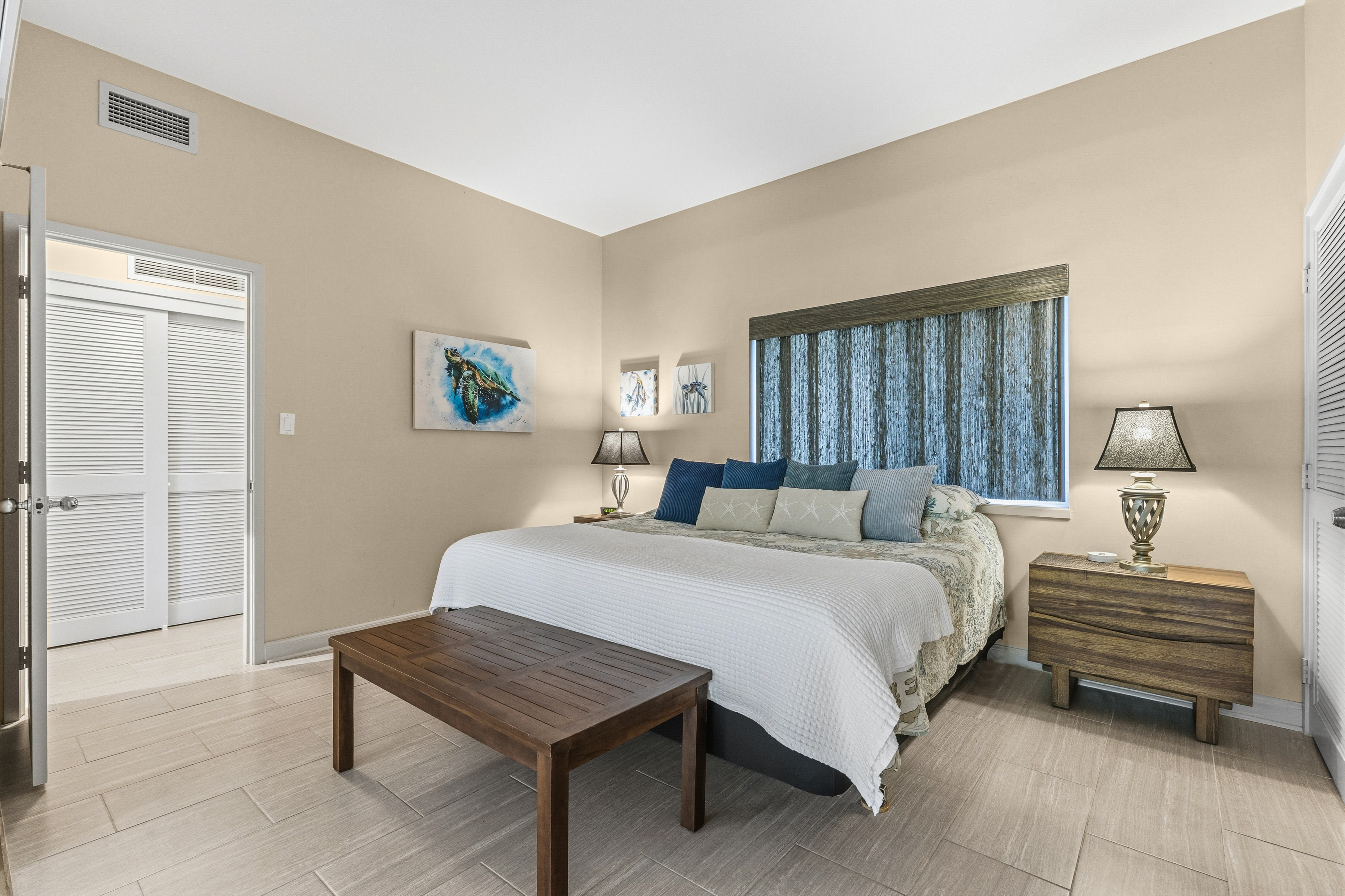 69-1010 Keana Place, Unit B101 Waikoloa, HI 96738 - Photo 16 of 30 a bedroom with a bed and a dresser