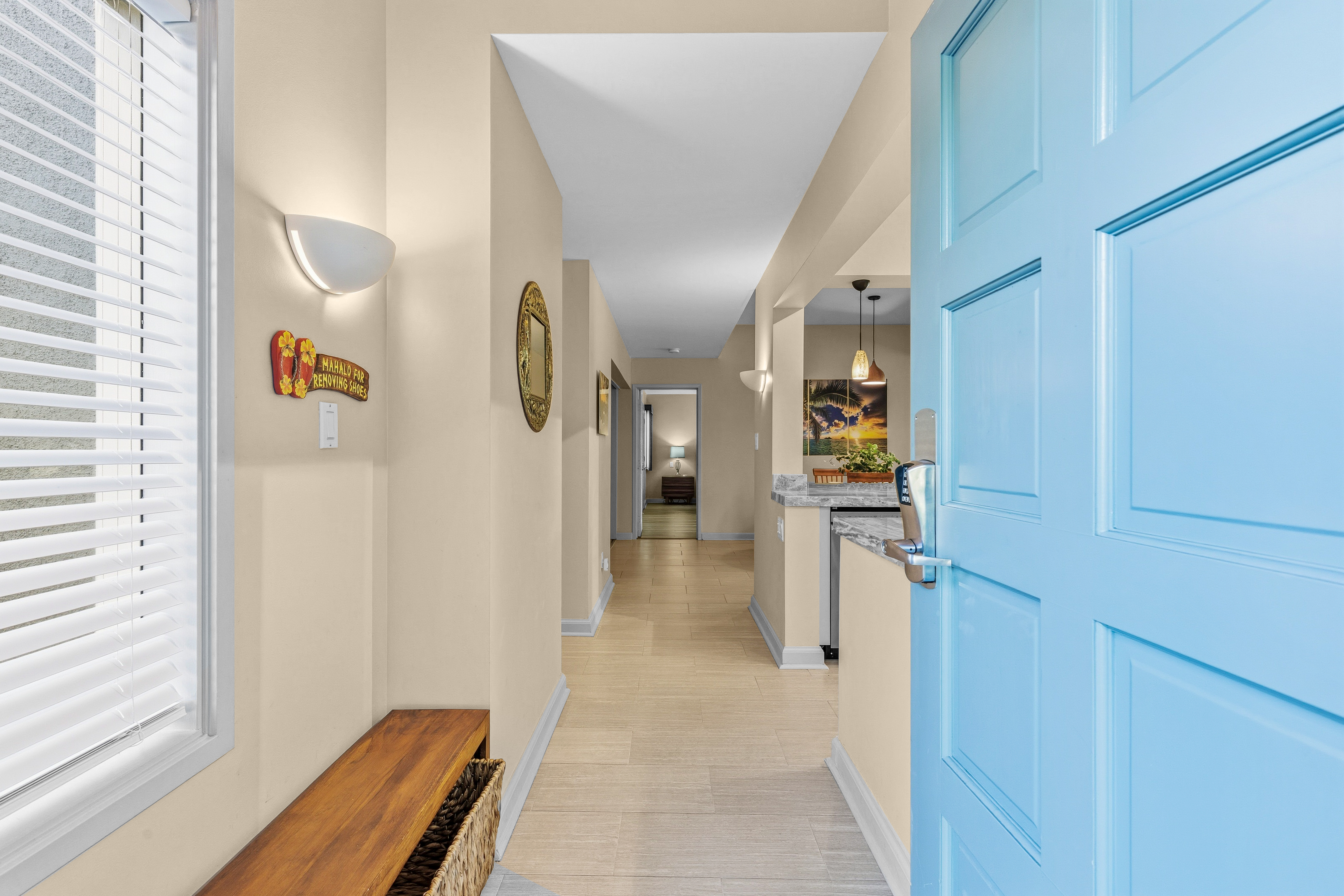 69-1010 Keana Place, Unit B101 Waikoloa, HI 96738 - Photo 18 of 30 a view of a hallway with wooden floor and staircase