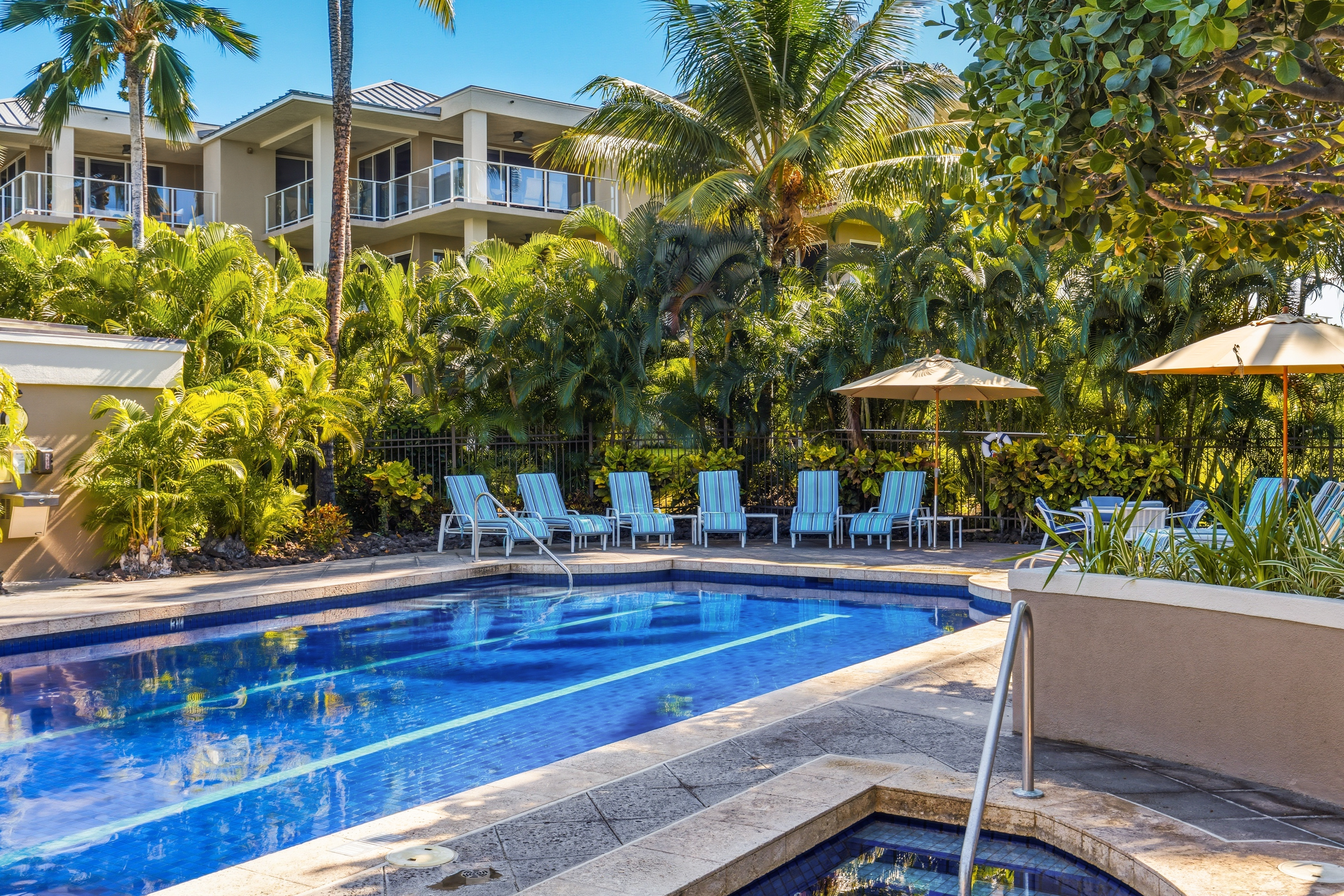 69-1010 Keana Place, Unit B101 Waikoloa, HI 96738 - Photo 21 of 30 a view of a building with sitting area and garden