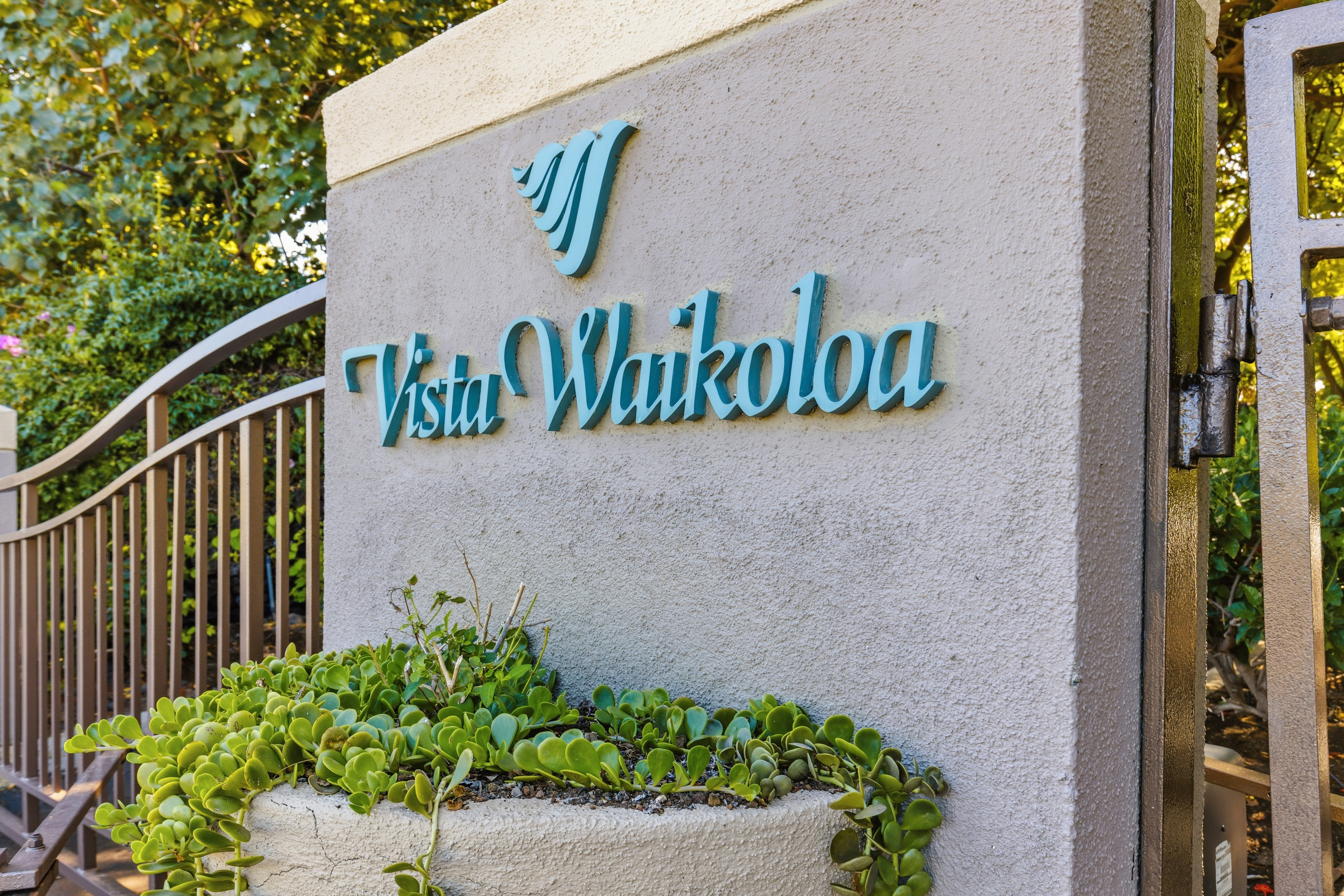 69-1010 Keana Place, Unit B101 Waikoloa, HI 96738 - Photo 25 of 30 a street sign that is on a wooden wall