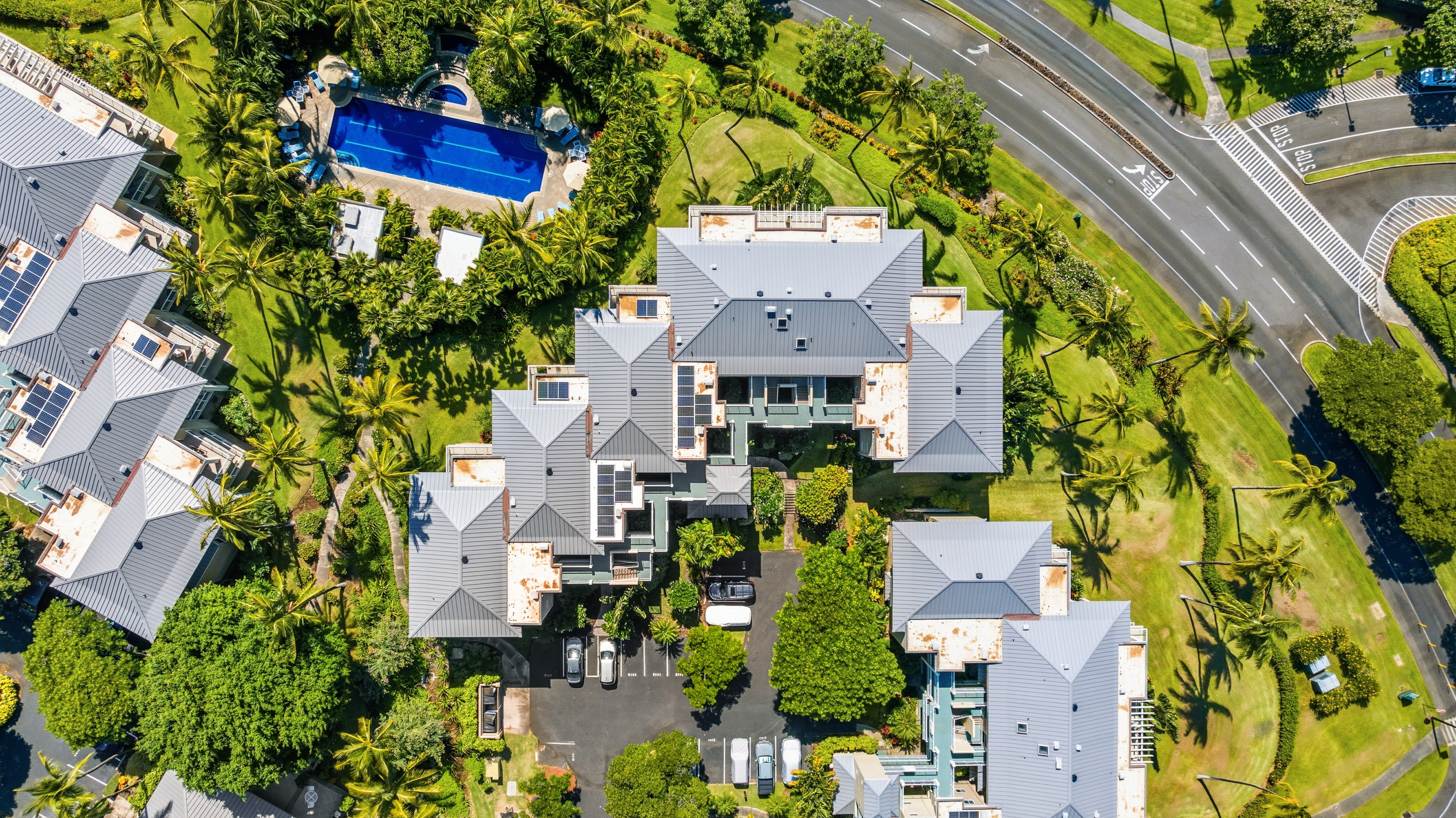 69-1010 Keana Place, Unit B101 Waikoloa, HI 96738 - Photo 27 of 30 an aerial view of a house with a yard and garden