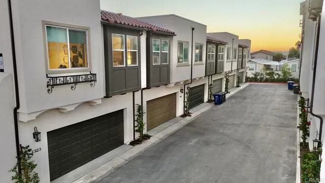 a view of a house with a yard from a balcony