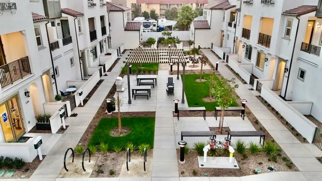 an aerial view of multiple houses with yard