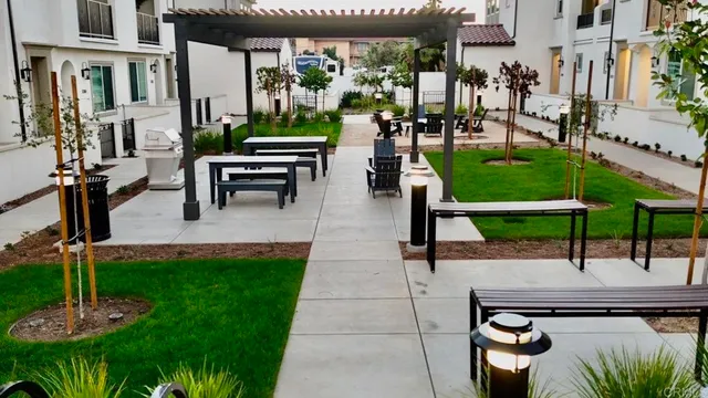 a patio with table and chairs