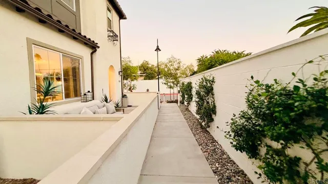 a swimming pool with outdoor seating and yard