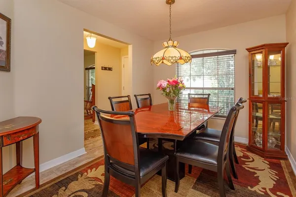a view of a dining room with furniture window and outside view