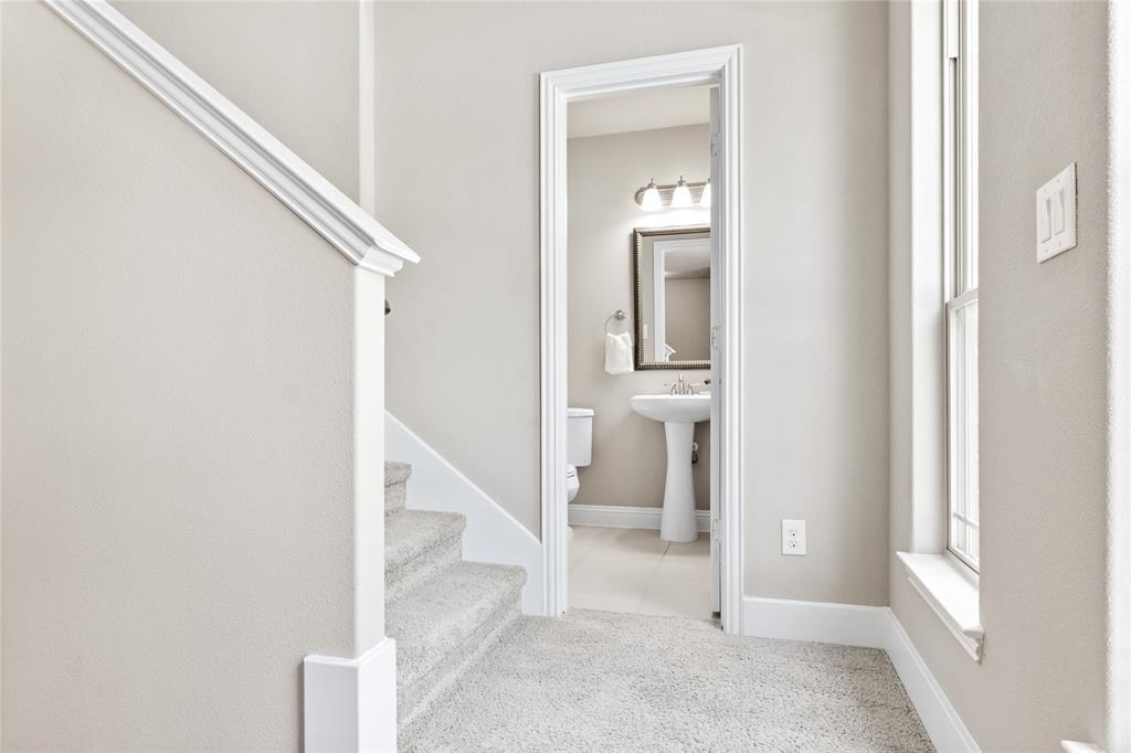 313 Tottenham Court McKinney, TX 75072 - Photo 18 of 31 a view of a hallway with wooden floor and entryway