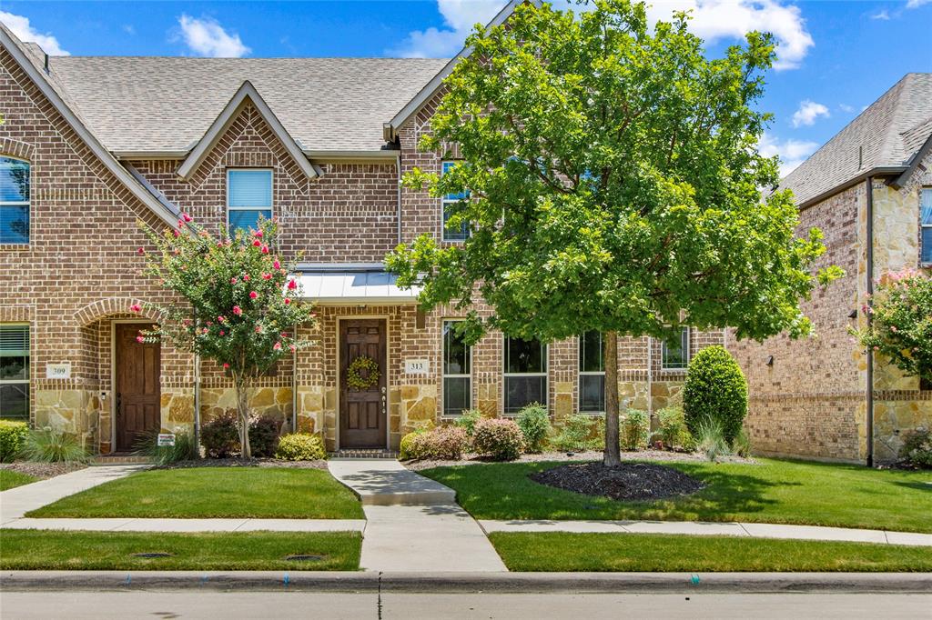 313 Tottenham Court McKinney, TX 75072 - Photo 2 of 31 a front view of a house with a yard