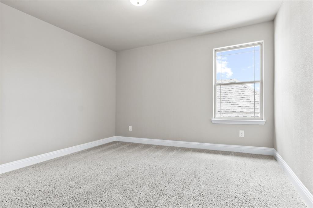 313 Tottenham Court McKinney, TX 75072 - Photo 24 of 31 an empty room with a window