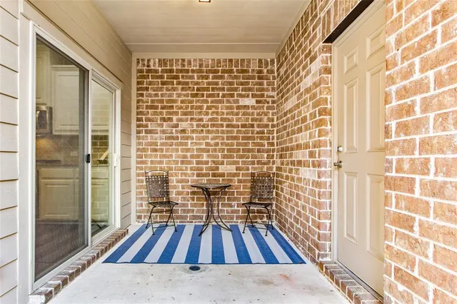 a view of wooden floor with a bathroom