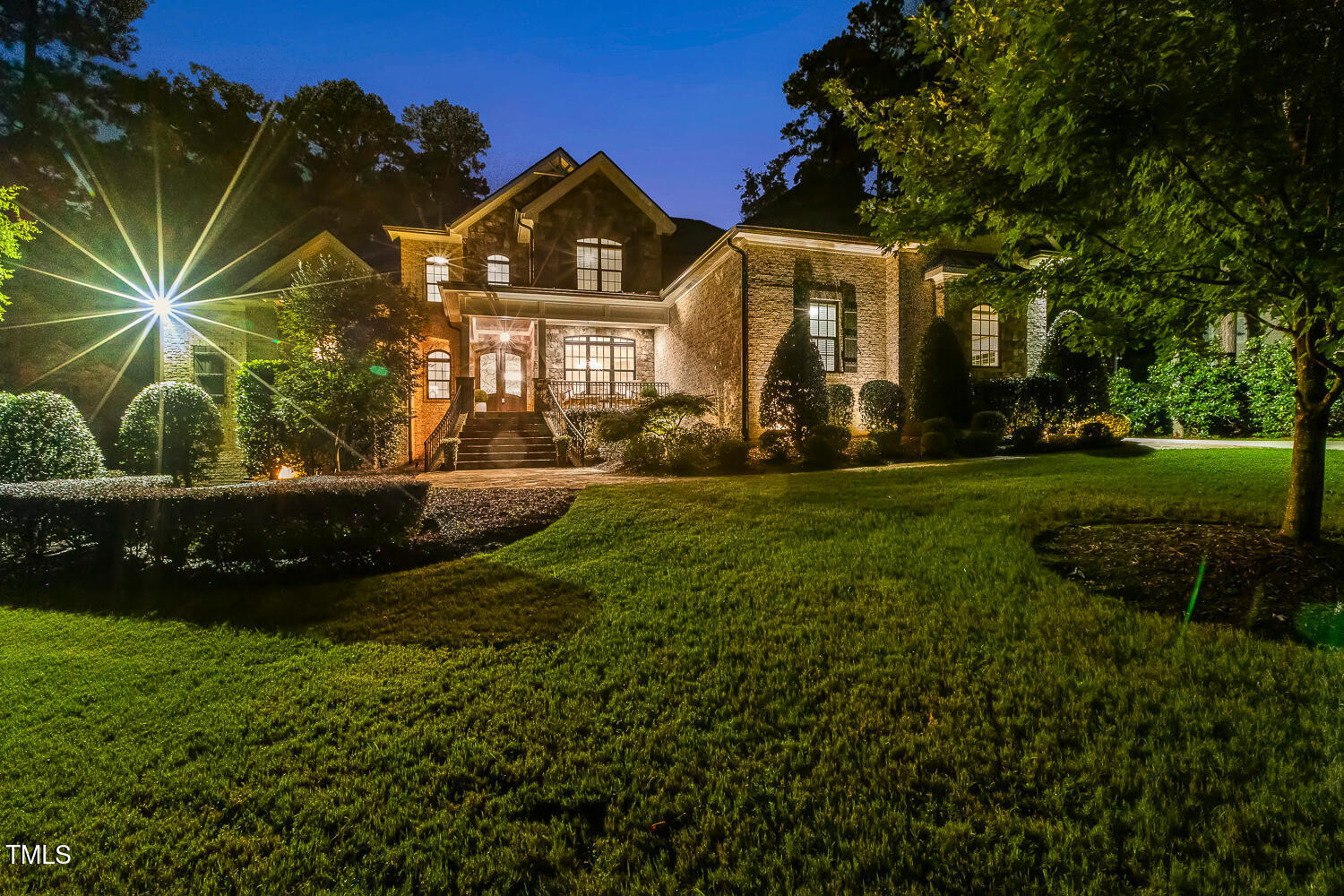 1205 Queensferry Road Cary, NC 27511 - Photo 4 of 63 a front view of a house with a yard