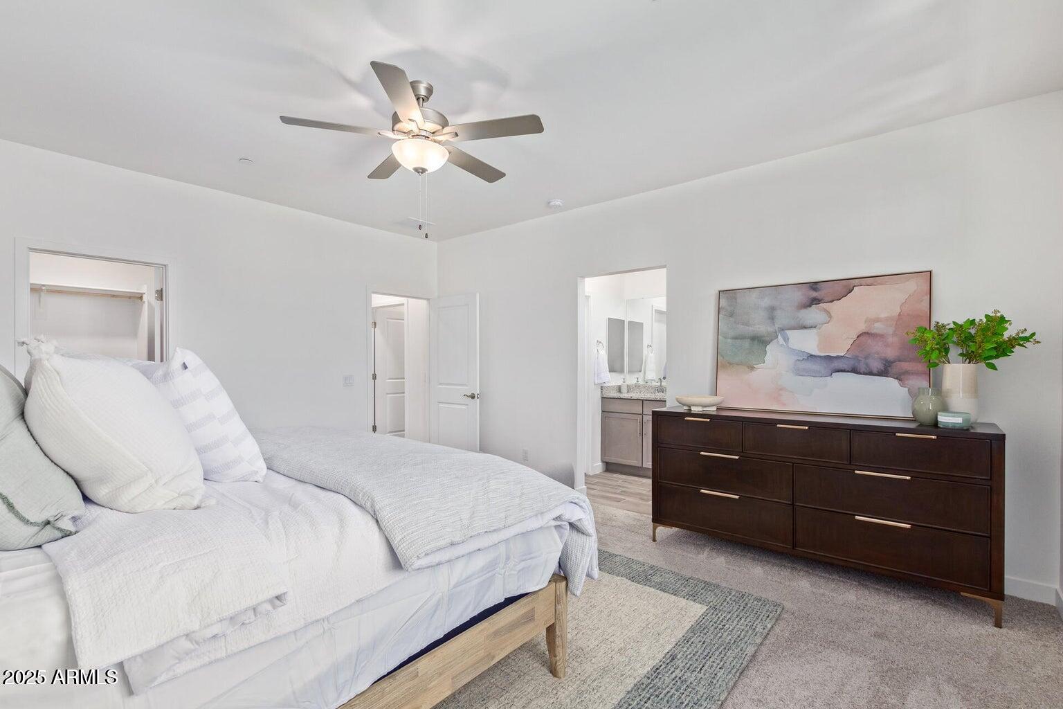 3230 East Thomas Road, Unit 168 Mesa, AZ 85213 - Photo 13 of 26 a bedroom with a bed and lamp on dresser