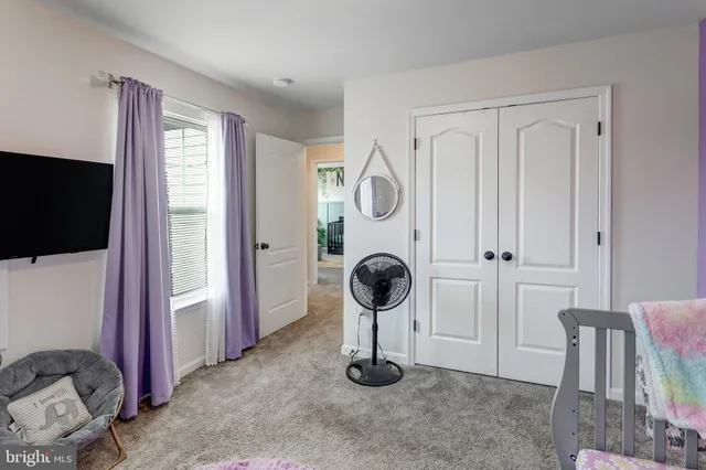 a view of a livingroom with furniture and windows