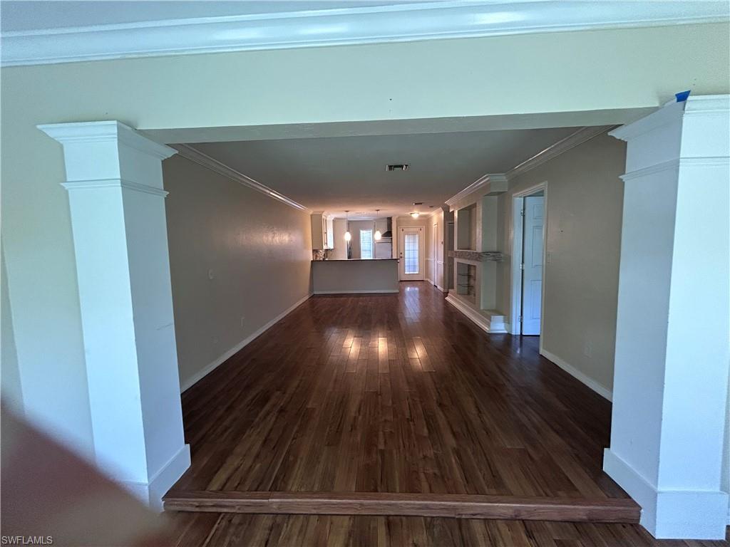 730 111th Avenue North Naples, FL 34108 - Photo 8 of 12 a view of gallery with wooden floor