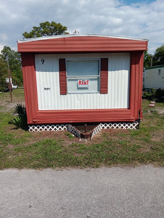 9440 Bourbon Street, Unit 9 New Port Richey, FL 34654 - Photo 2 of 2 a front view of a house