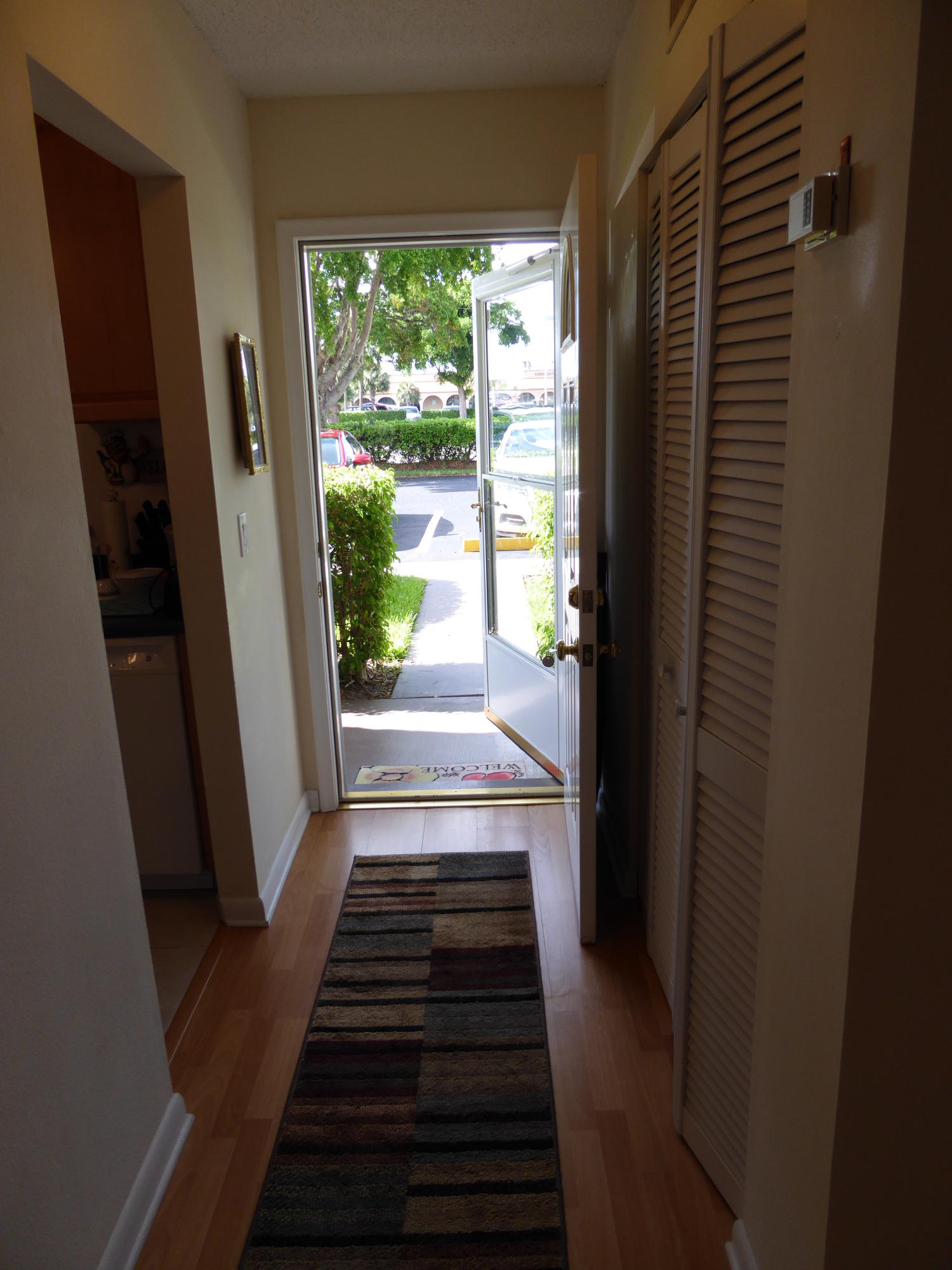 9911 Sandalfoot Boulevard, Unit 105 Boca Raton, FL 33428 - Photo 4 of 14 Entry Hallway