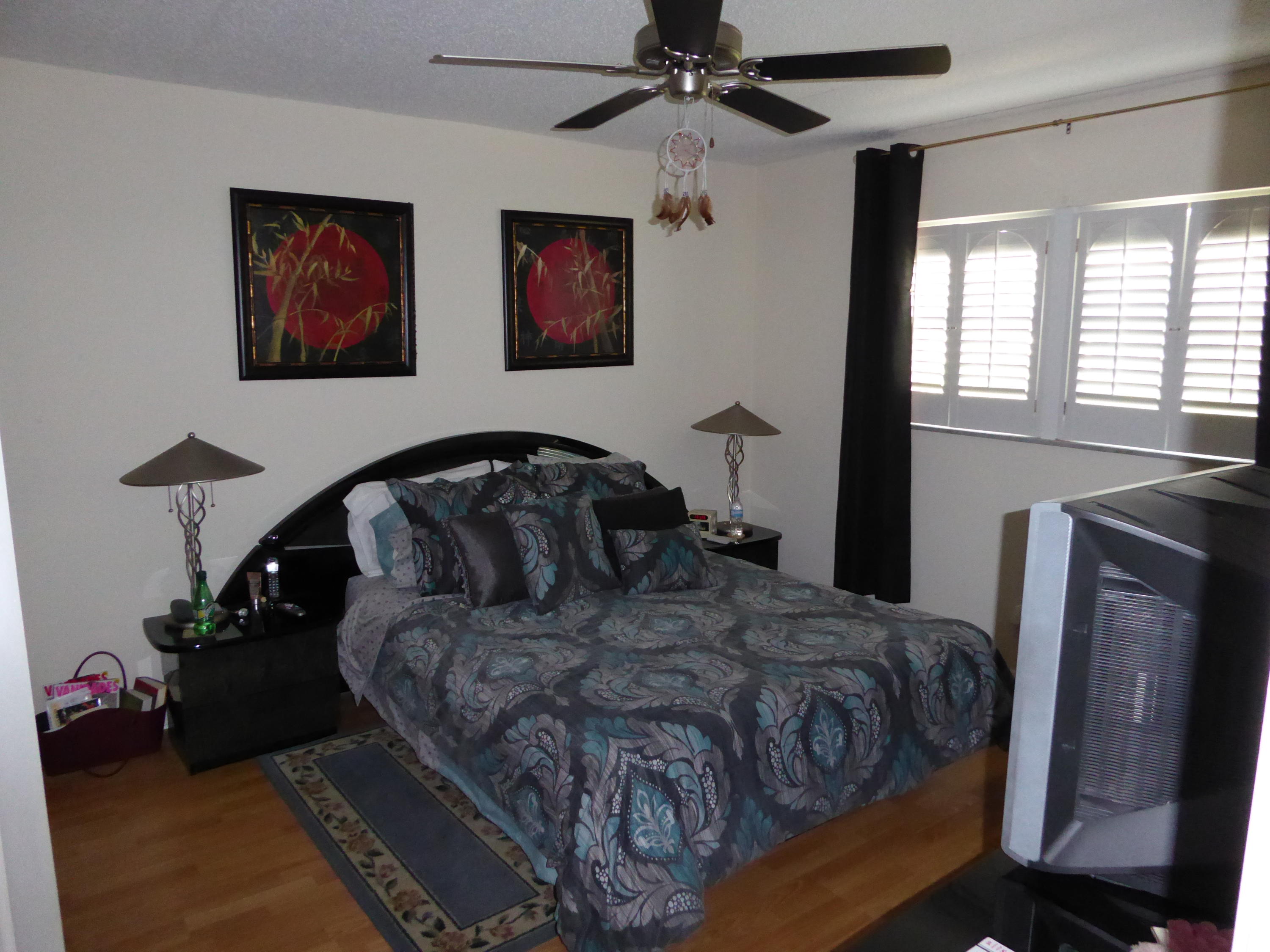 9911 Sandalfoot Boulevard, Unit 105 Boca Raton, FL 33428 - Photo 10 of 14 Master Bedroom