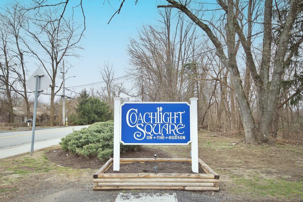 252 Coachlight Square, Unit 252 Montrose, NY 10548 - Photo 1 of 1 a sign broad on the side of the road