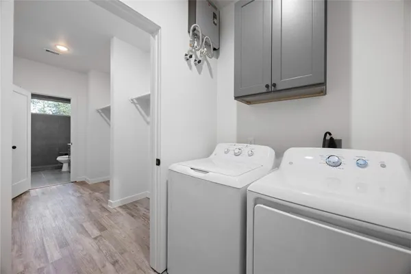 a view of storage and utility room with washer and dryer