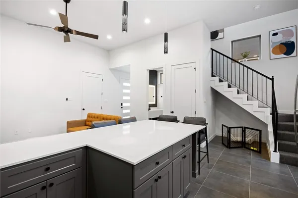 a utility room with sink and cabinets