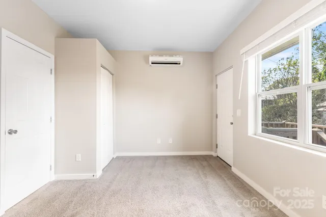 a view of a room with a large window