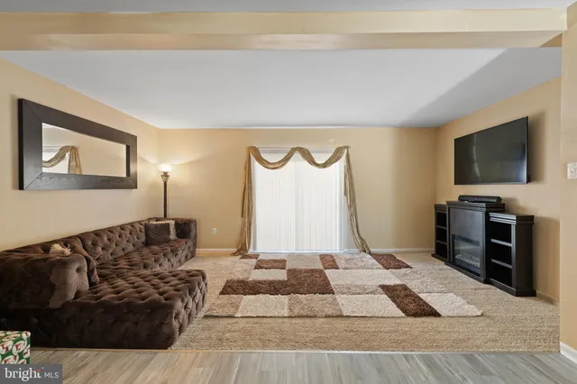 a living room with a couch and a flat screen tv