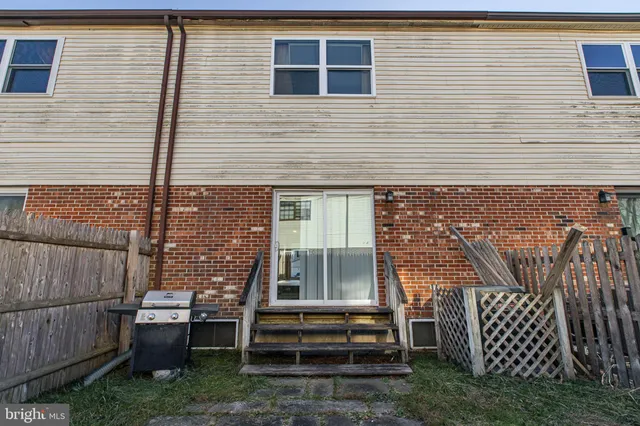 a front view of a house with stairs